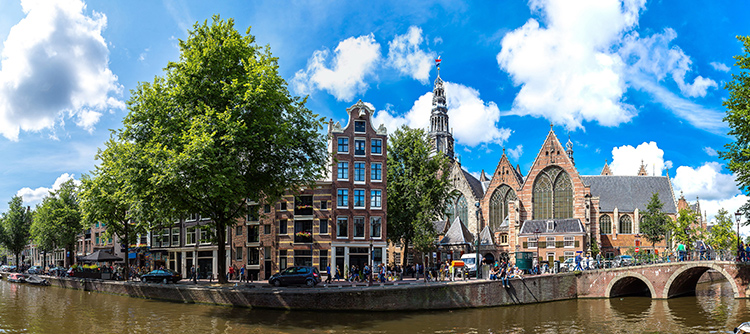 Historic buildings and bridges along Amsterdam canals