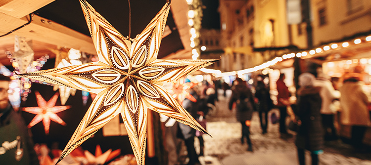 Traditional illuminated star ornament at a Christmas fair