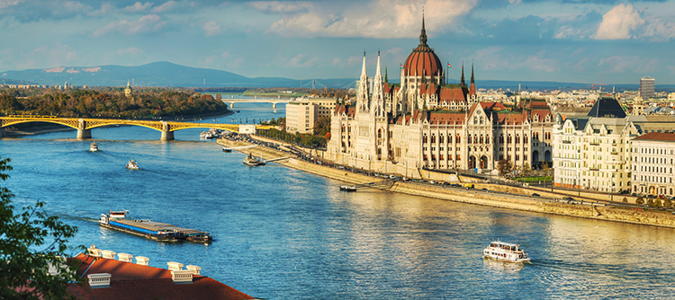 The Danube River along the shore of Budapest, featuring the grand Parliament building