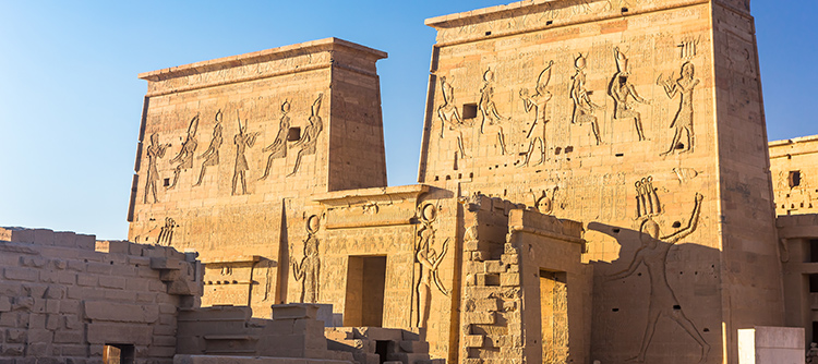 The Temple of Philae with ancient carvings on the facade